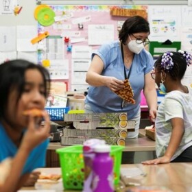 Lisa Steck's third grade class enjoys a pizza party at Berkshire Elementary School on March 3, 2023. (Kaitlin Newman/The Baltimore Banner)