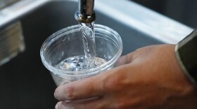 FILE - A cup of water is drawn from a faucet at Johnny T's Bistro and Blues, a midtown Jackson, Miss., restaurant and entertainment venue on Sept. 1, 2022. The beleaguered water system in Mississippi's capital city disrupted daily life for 150,000 residents for several days, but Jackson's water is now safe to drink according to the Environmental Protection Agency on Monday, Oct. 31, 2022. (AP Photo/Rogelio V. Solis, File)