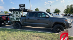 Protest signs like these have dotted many of the meetings where residents unanimously opposed the 70-mile power line. (Rona Kobell/The Baltimore Banner)