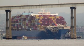 Tugboats escort the cargo ship Dali after it was refloated in Baltimore, Monday, May 20, 2024. The container ship that caused the deadly collapse of Baltimore's Francis Scott Key Bridge was refloated Monday and has begun slowly moving back to port. (AP Photo/Matt Rourke)