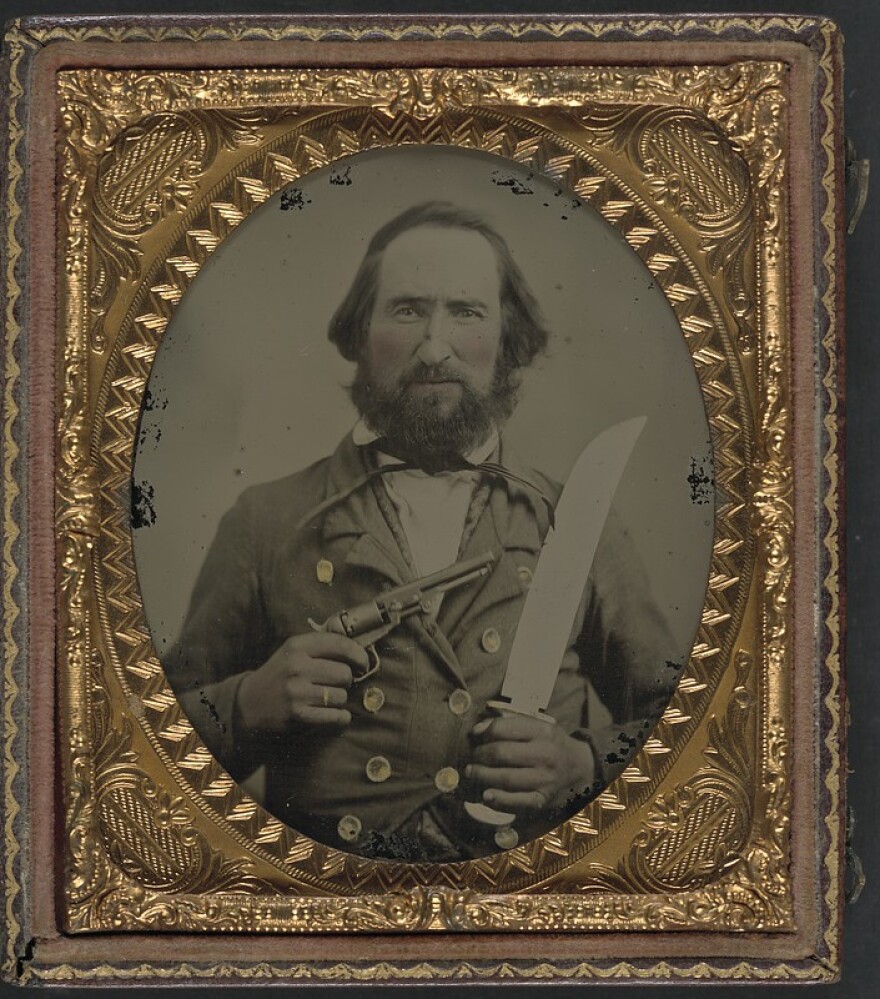 Unidentified soldier in Confederate uniform with large Bowie knife and revolver Credit: LOC/Flickr/Creative Commons