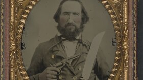 Unidentified soldier in Confederate uniform with large Bowie knife and revolver Credit: LOC/Flickr/Creative Commons