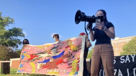 The protesters on Thursday also demanded full disclosure of the university’s divestments into weapons companies like Lockheed Martin, and the abolishment of the Johns Hopkins Police Department. Photo by Bri Hatch/WYPR.