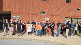 People wear black in opposition to the Carroll County superintendent’s decision to remove 56 books from school libraries until a committee reviews them. (Kristen Griffith/The Baltimore Banner)