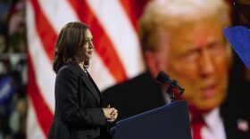 Vice President Kamala Harris plays a highlight reel of her opponent, former President Donald Trump, during a rally in Erie, Pa., on October 14, 2024.