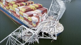 FILE - In this image from video released by the National Transportation and Safety Board, the container ship Dali is stuck under part of the structure of the Francis Scott Key Bridge after the ship hit the bridge, Tuesday, March 26, 2024, in Baltimore. (NTSB via AP, File)