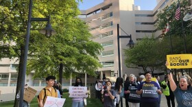 Protestors in front of the Edward A. Garmatz U.S. District Courthouse on Tuesday. Credit: Sarah Y. Kim/WYPR