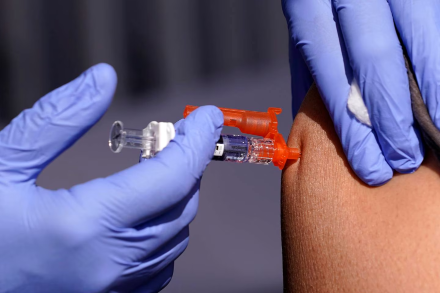 With a rise in COVID-19 cases driven by a new variant of the virus, health officials are urging people to get up to date on their vaccines. (AP Photo/Mark J. Terrill)