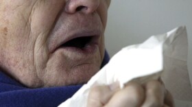 FILE - In this Jan. 14, 2005 file photo, a man sneezes holding a tissue in Berlin, Germany. According to a case study published Monday, Jan. 15, 2018, in the journal BMJ Case Reports, doctors in England say stifling a big sneeze can be hazardous for your health in rare cases, based on the very unusual experience of a man who ruptured the back of his throat when he tried to stop a sneeze. (AP Photo/Roberto Pfeil, File)