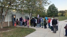 People line up Thursday, October 24, 2024 at the Honeygo Run Community Center in Perry Hall for the first day of early voting. Photo by John Lee/WYPR.