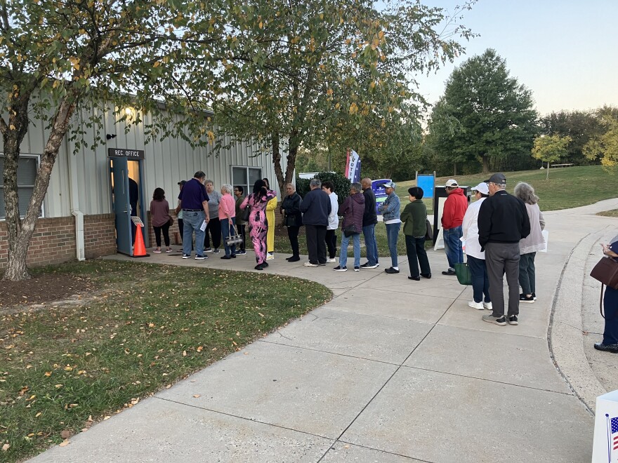 People line up Thursday, October 24, 2024 at the Honeygo Run Community Center in Perry Hall for the first day of early voting. Photo by John Lee/WYPR.