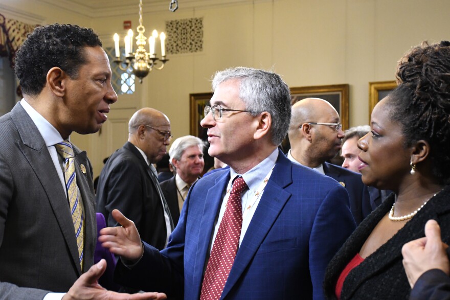 Maryland Department of Juvenile Services Secretary Vincent Schiraldi, center, speaks with Baltimore State's Attorney Ivan Bates, left, and Prince George's County State's Attorney Aisha Braveboy at the State House in Annapolis on Tuesday, Jan. 9, 2024. They spoke after Gov. Wes Moore held a press conference to announce public safety proposals. Photo by Pamela Wood/The Baltimore Banner.