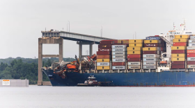 The Dali cargo ship begins to move on Monday morning from the Key Bridge wreckage site. (Wesley Lapointe/For The Baltimore Banner)