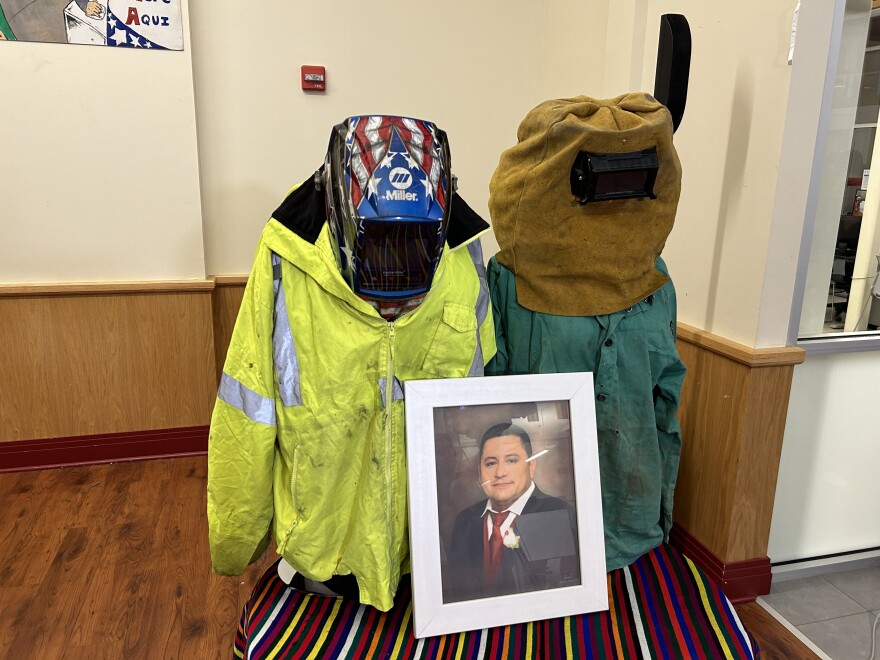 Miguel Luna’s uniform on display. A CASA spokesperson said his wife Carmen, wanted people to see the shrapnel from his welding. Photo by Wambui Kamau/WYPR.