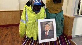 Miguel Luna’s uniform on display. A CASA spokesperson said his wife Carmen, wanted ppl to see the shrapnel from his welding. Photo by Wambui Kamau/WYPR.