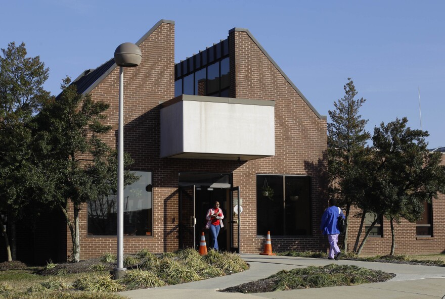 People walk outside of the entrance to Clifton T. Perkins Hospital in Jessup, Md., Wednesday, Feb. 15, 2012.  (AP Photo/Patrick Semansky)