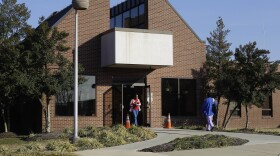 People walk outside of the entrance to Clifton T. Perkins Hospital in Jessup, Md., Wednesday, Feb. 15, 2012.  (AP Photo/Patrick Semansky)