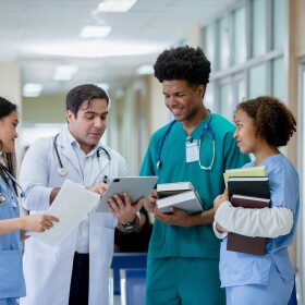 Doctors and Nurses Discussing Patient Care in a Modern Hospital Setting