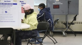 FILE - Voters fill out their ballots at a polling center during early voting, Oct. 23, 2021, in Buffalo, N.Y. (AP Photo/Joshua Bessex, File)