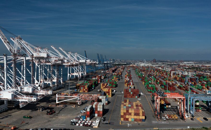 Cargo containers are readied for transport at the Port of Baltimore in 2021.